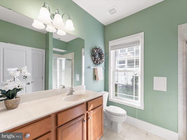 bathroom with vanity, toilet, a notable chandelier, tile patterned flooring, and an enclosed shower