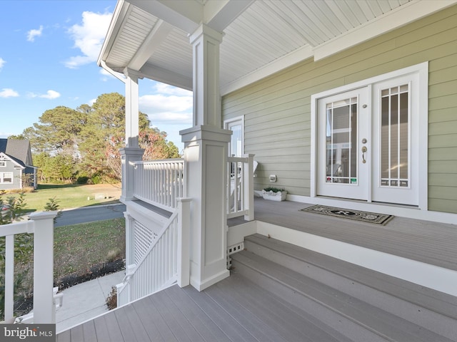 wooden terrace featuring a porch