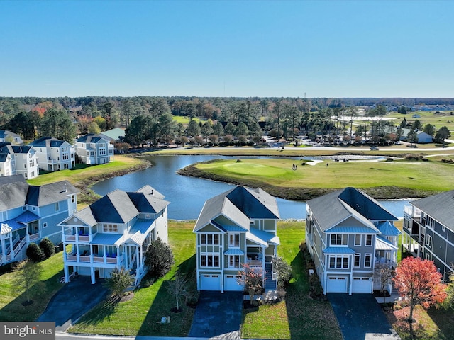 birds eye view of property with a water view