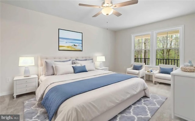 bedroom featuring ceiling fan and light colored carpet