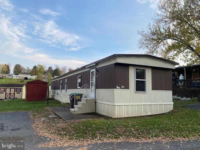 view of property exterior featuring a storage unit