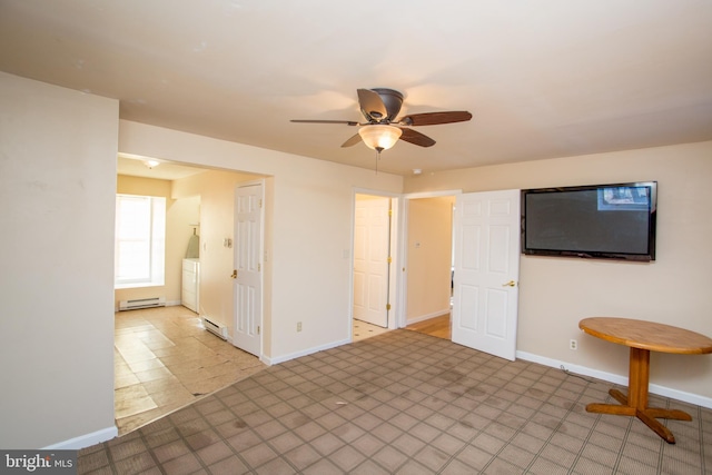 unfurnished living room with washer / clothes dryer, ceiling fan, and a baseboard radiator