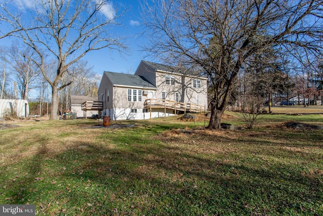 view of home's exterior featuring a yard and a wooden deck