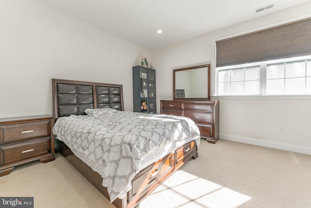 bedroom featuring light colored carpet