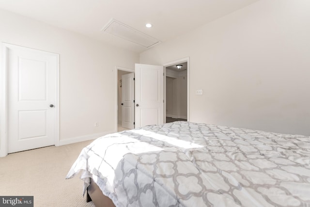 bedroom featuring light carpet