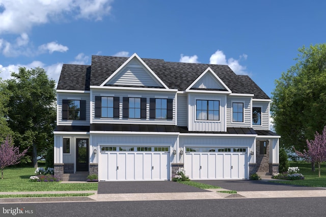 view of front facade featuring a front yard and a garage