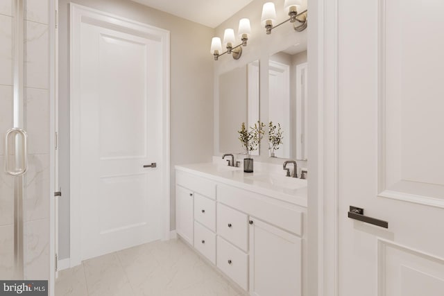 bathroom with vanity and a shower with shower door