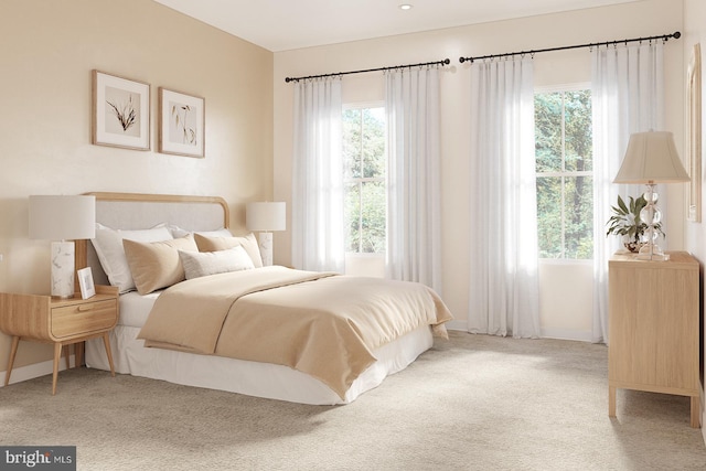 carpeted bedroom featuring multiple windows