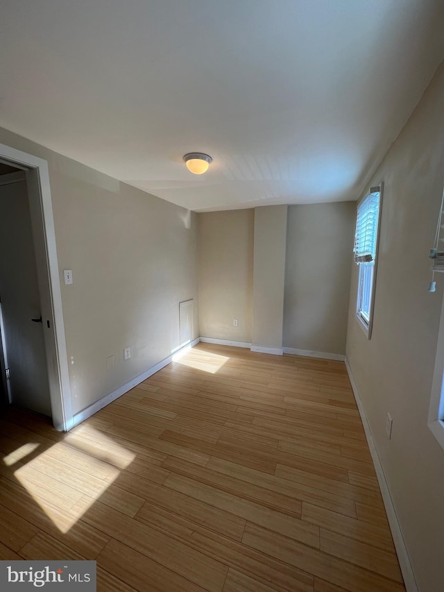 unfurnished room featuring light hardwood / wood-style flooring