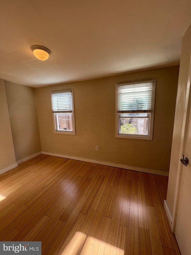 spare room with light wood-type flooring