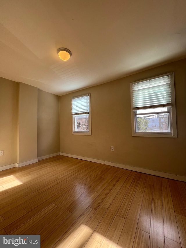 spare room featuring light hardwood / wood-style flooring