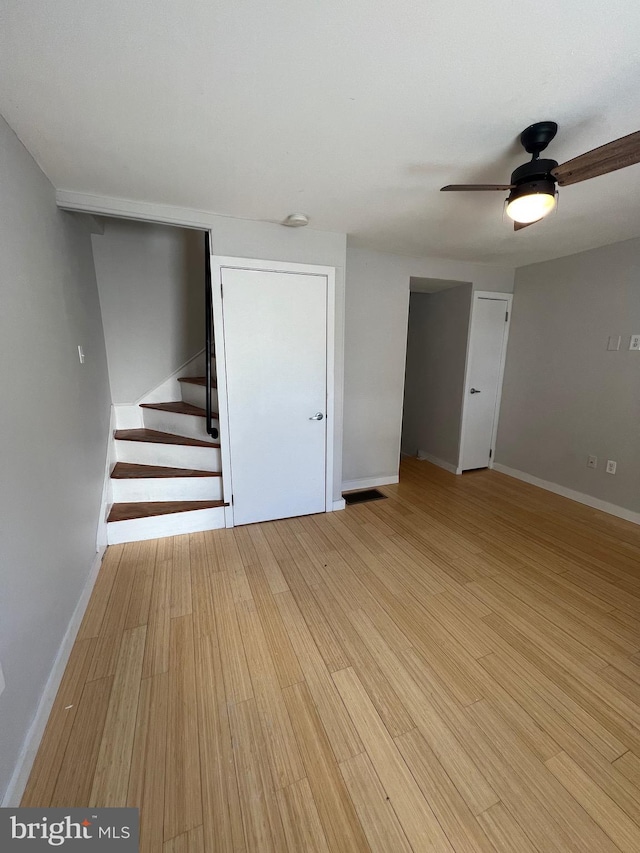 interior space with light hardwood / wood-style flooring and ceiling fan