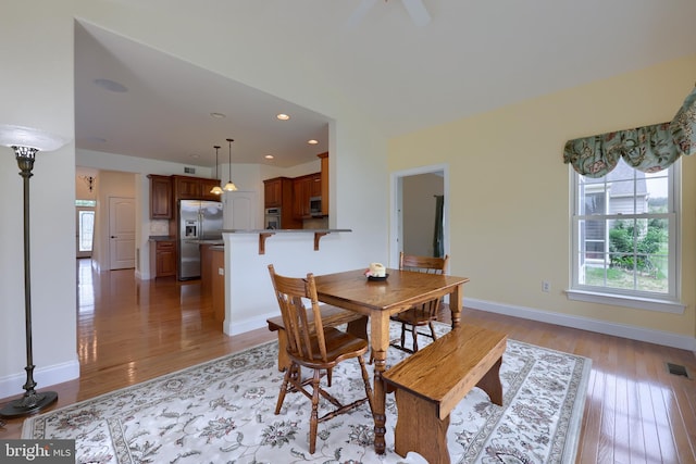 dining area with light hardwood / wood-style floors