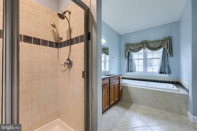 bathroom with vanity, tile patterned floors, and separate shower and tub