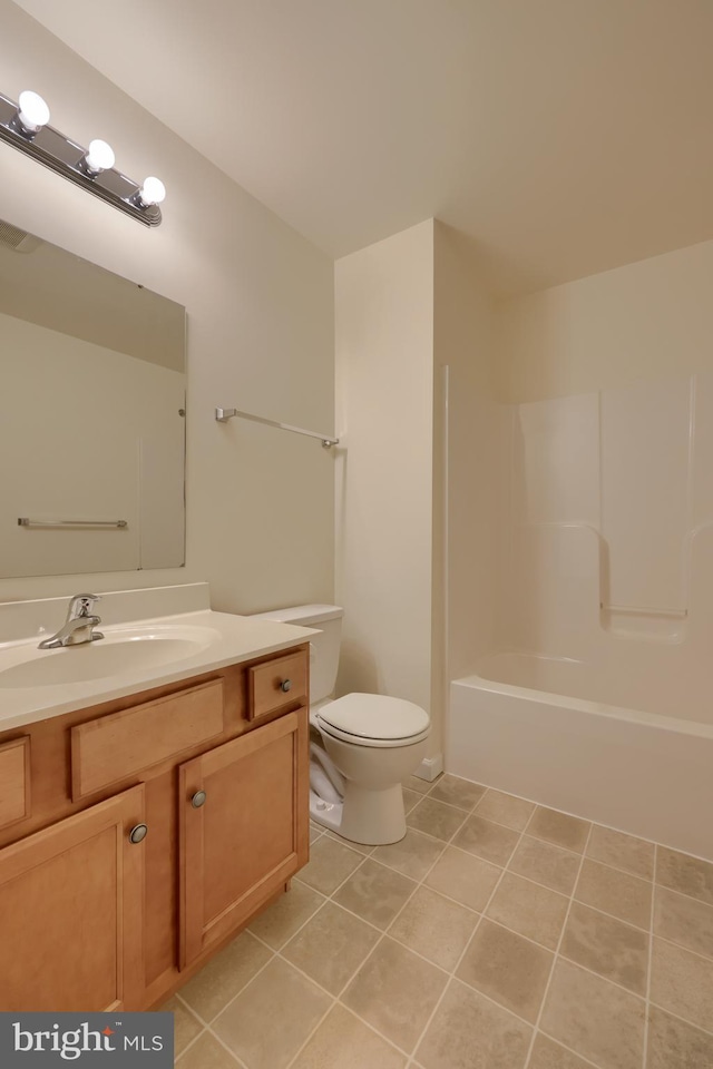 full bathroom featuring vanity, tile patterned flooring, toilet, and  shower combination