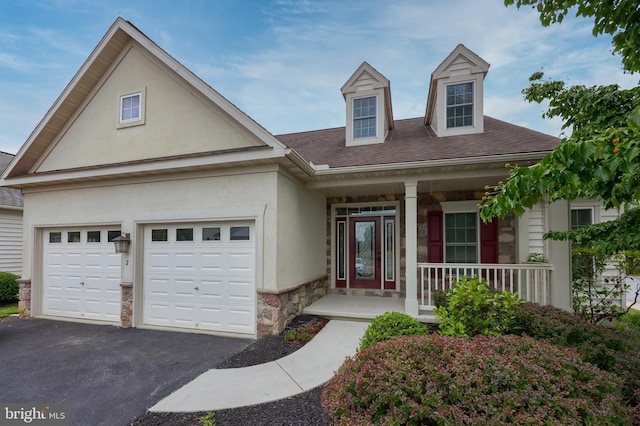 view of front of house featuring a garage and covered porch