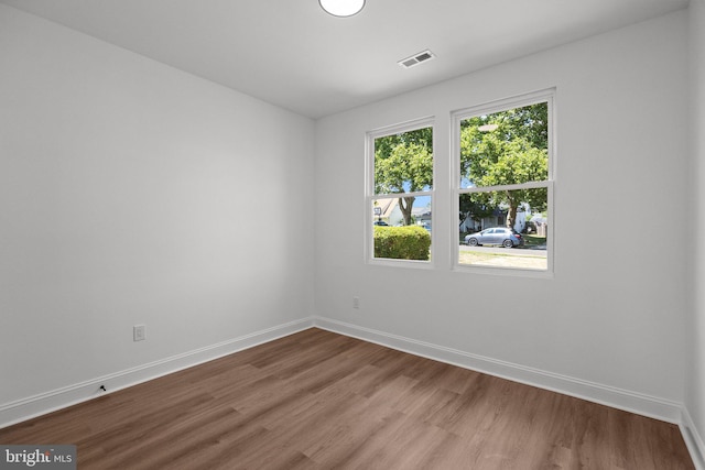 unfurnished room featuring hardwood / wood-style floors