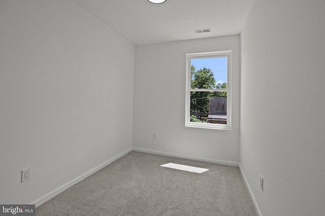 spare room featuring carpet flooring