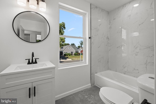 full bathroom with vanity, toilet, and tiled shower / bath combo