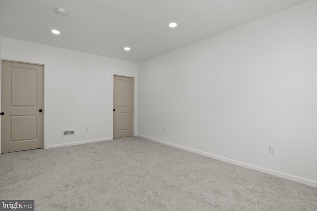 spare room with light carpet