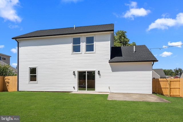 back of property featuring a patio and a yard