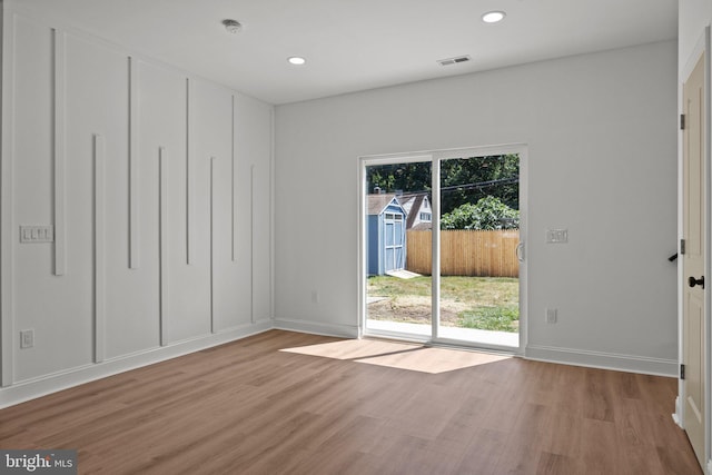 empty room with light wood-type flooring