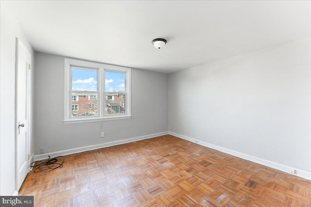 spare room with light parquet flooring