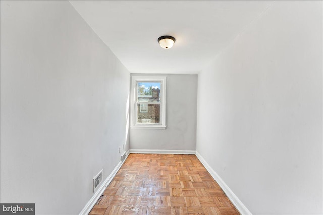 spare room with light parquet flooring