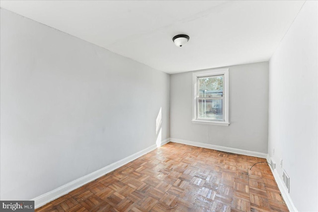 empty room with light parquet floors