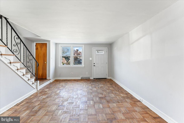 entrance foyer featuring light parquet flooring