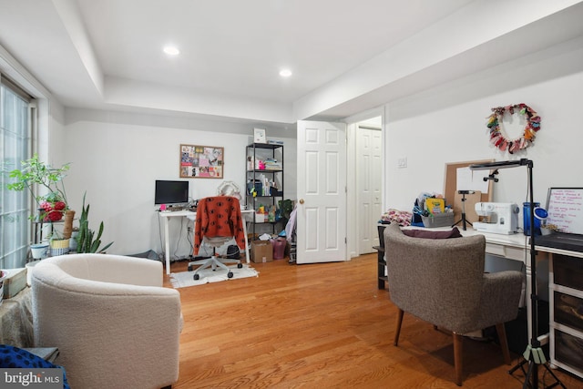 home office with hardwood / wood-style flooring