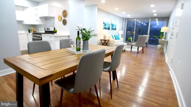 dining space featuring light wood-type flooring