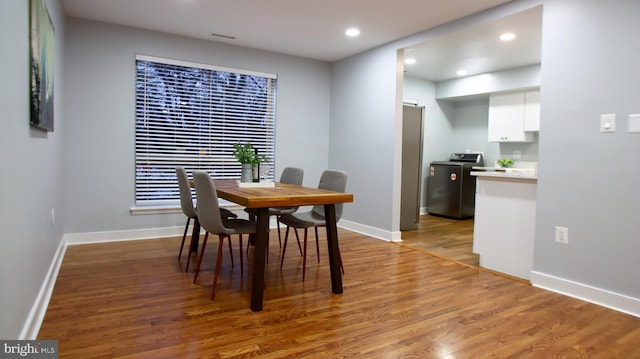 dining area with hardwood / wood-style flooring