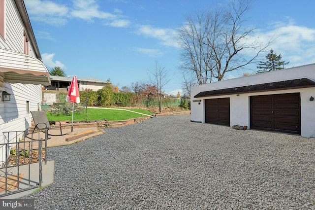 garage with a yard