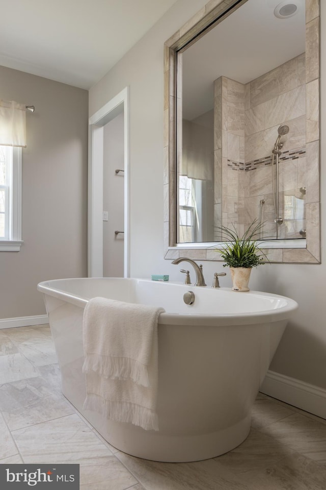 0707007728 Hook Rd Nottingham, Unit Nottingham, Westminster, MD 21157 - full bathroom featuring a freestanding bath, baseboards, and a tile shower