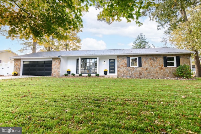 ranch-style home featuring a garage and a front yard