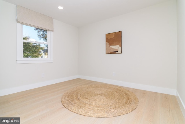 empty room with wood-type flooring