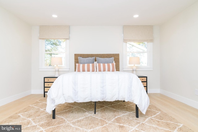 bedroom with wood-type flooring