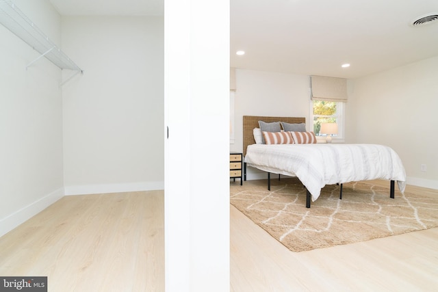 bedroom with light hardwood / wood-style flooring