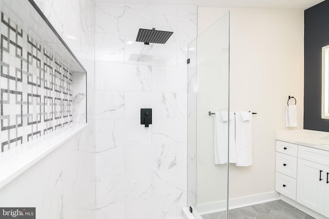 bathroom featuring vanity and tiled shower