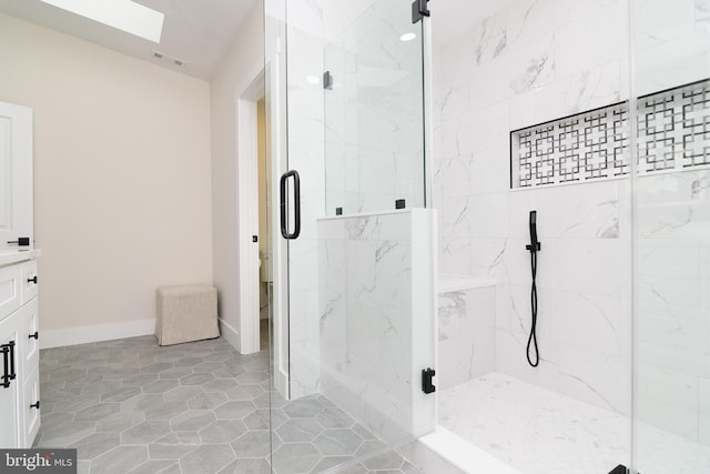 bathroom featuring walk in shower, vanity, and toilet