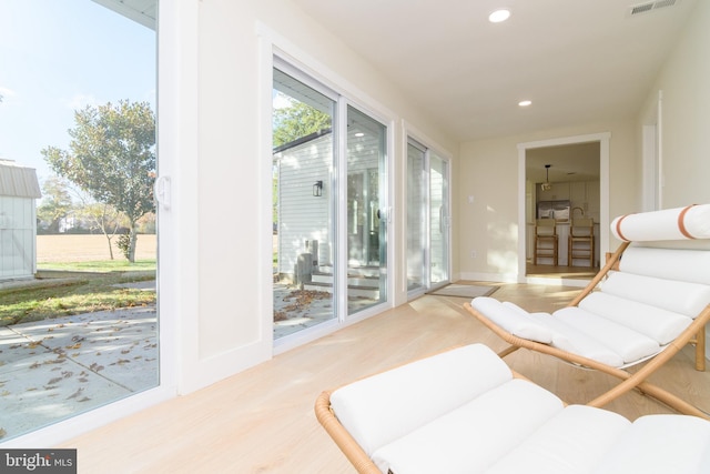 living area with light hardwood / wood-style floors