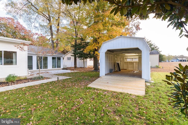 view of yard with a storage shed and a carport