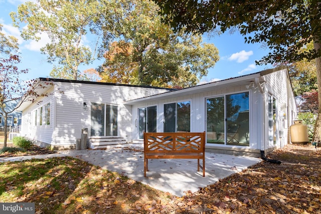 back of house with a patio