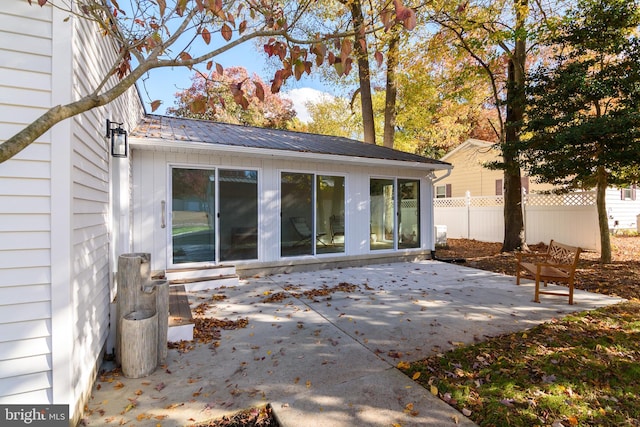 rear view of property featuring a patio