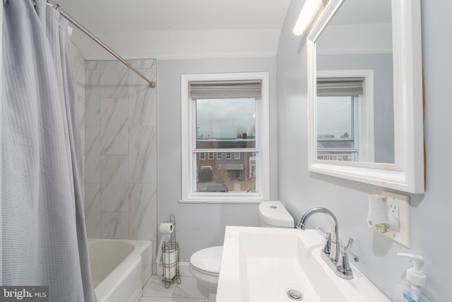 full bathroom featuring toilet, shower / bathtub combination with curtain, and sink