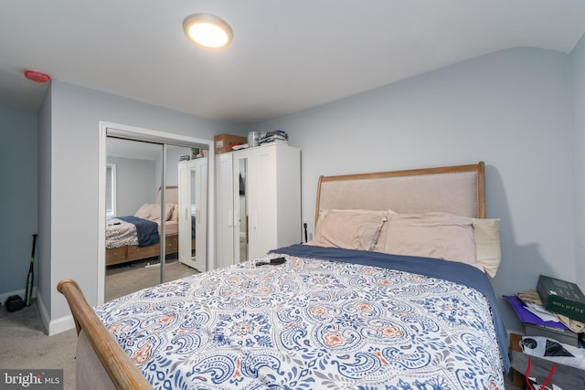 bedroom featuring light carpet and a closet