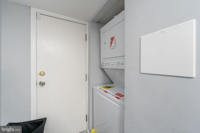 laundry room featuring stacked washer and dryer