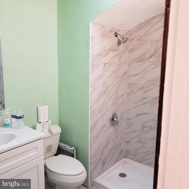 4116 Garrison Blvd, Baltimore, MD 21215 - full bathroom featuring a shower stall, toilet, vanity, and a textured ceiling