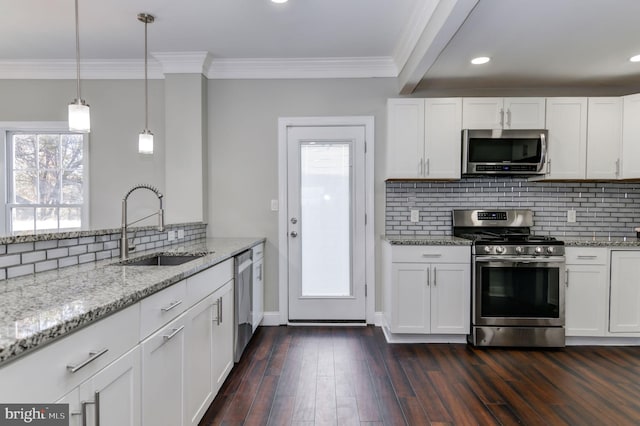 kitchen featuring white cabinetry, a wealth of natural light, stainless steel appliances, and dark hardwood / wood-style flooring